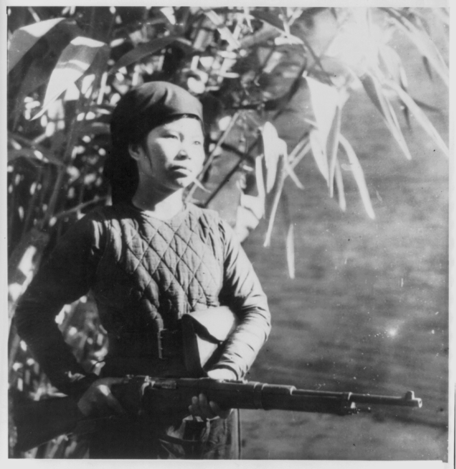 A [Vietnamese] woman-guerilla on guard duty, [ca. 1953] — historic photograph
