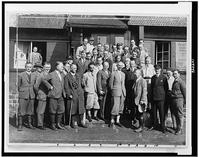 [Group of prominent members of aeronautic organizations posed, full-length, in Germany, at the Rhön-Segelflug-Wettbewerb]