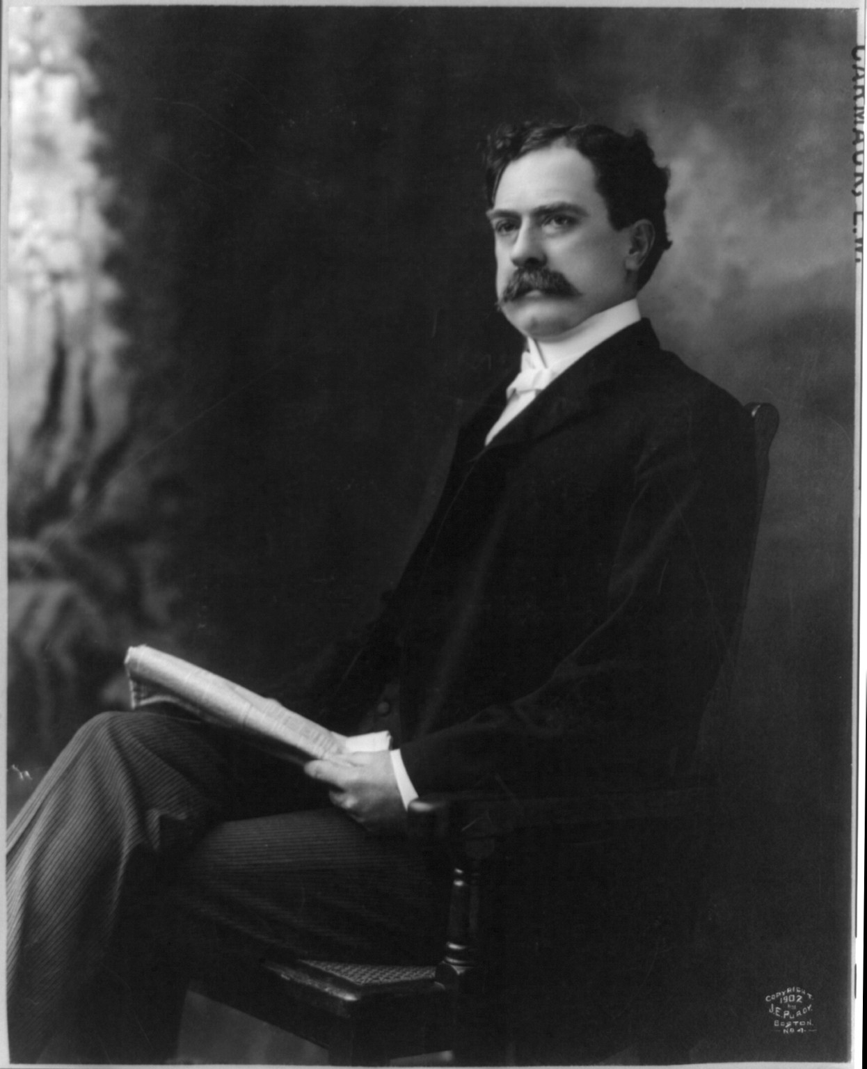 [Edward Ward Carmack, 1858-1908, three-quarters length, seated, facing left], c1902. — historic photograph
