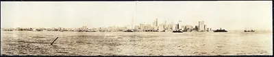 Panoramic view of a city skyline across the harbor