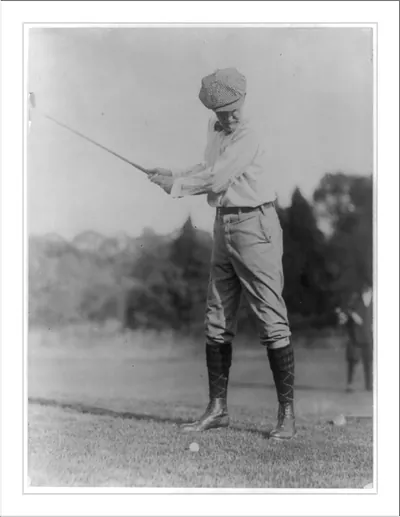 [Man swinging at golf ball, Washington, D.C., area]