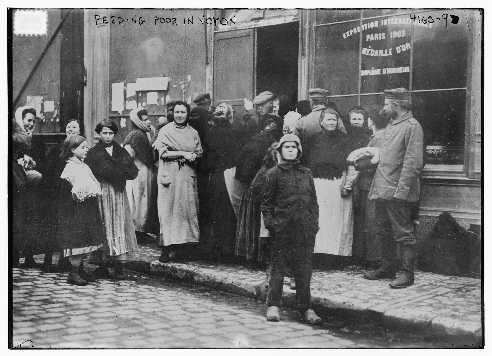 Feeding poor in Noyon, n/a — historic photograph