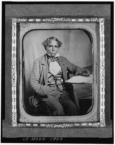 [Edward Morris, three-quarter length portrait, full face, seated at desk]