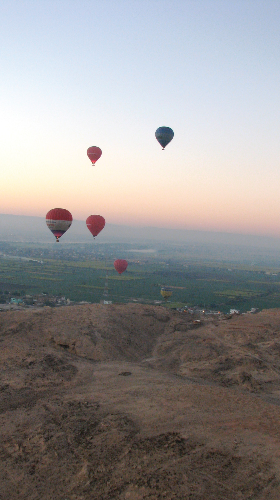 Hot air balloons over a valley at dawn — historic image