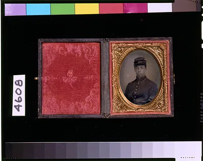 [Unidentified Union soldier in frock coat, private, kepi, 3rd-5th buttons open on coat]