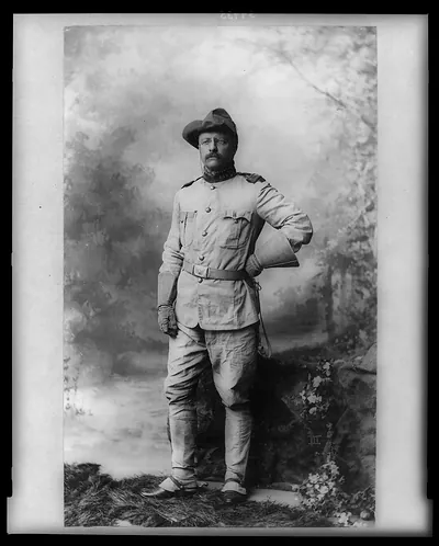 [Colonel Theodore Roosevelt, in rough rider uniform, full-length portrait, standing, facing slightly left]