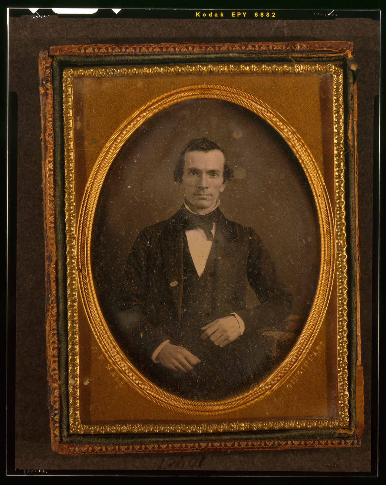 [Unidentified man, half-length portrait, with arm resting on table with tablecloth], [between 1847 and 1860] — historic photograph
