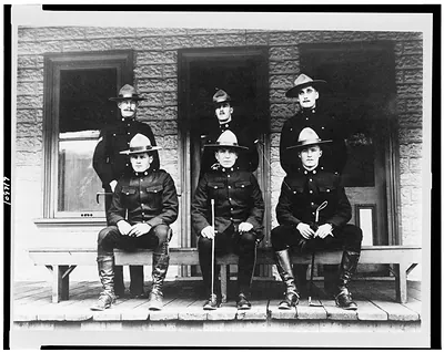 [Six policemen posed on porch, Dawson, Yukon Territory, Canada]