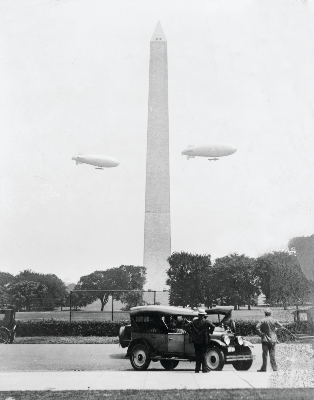 U.S. Army blimps, the T.C. 5 and T.C. 9 from Langley Field, Va. passing over the Washington Monument during a practice flight, [between 1920 and 1932] — historic photograph