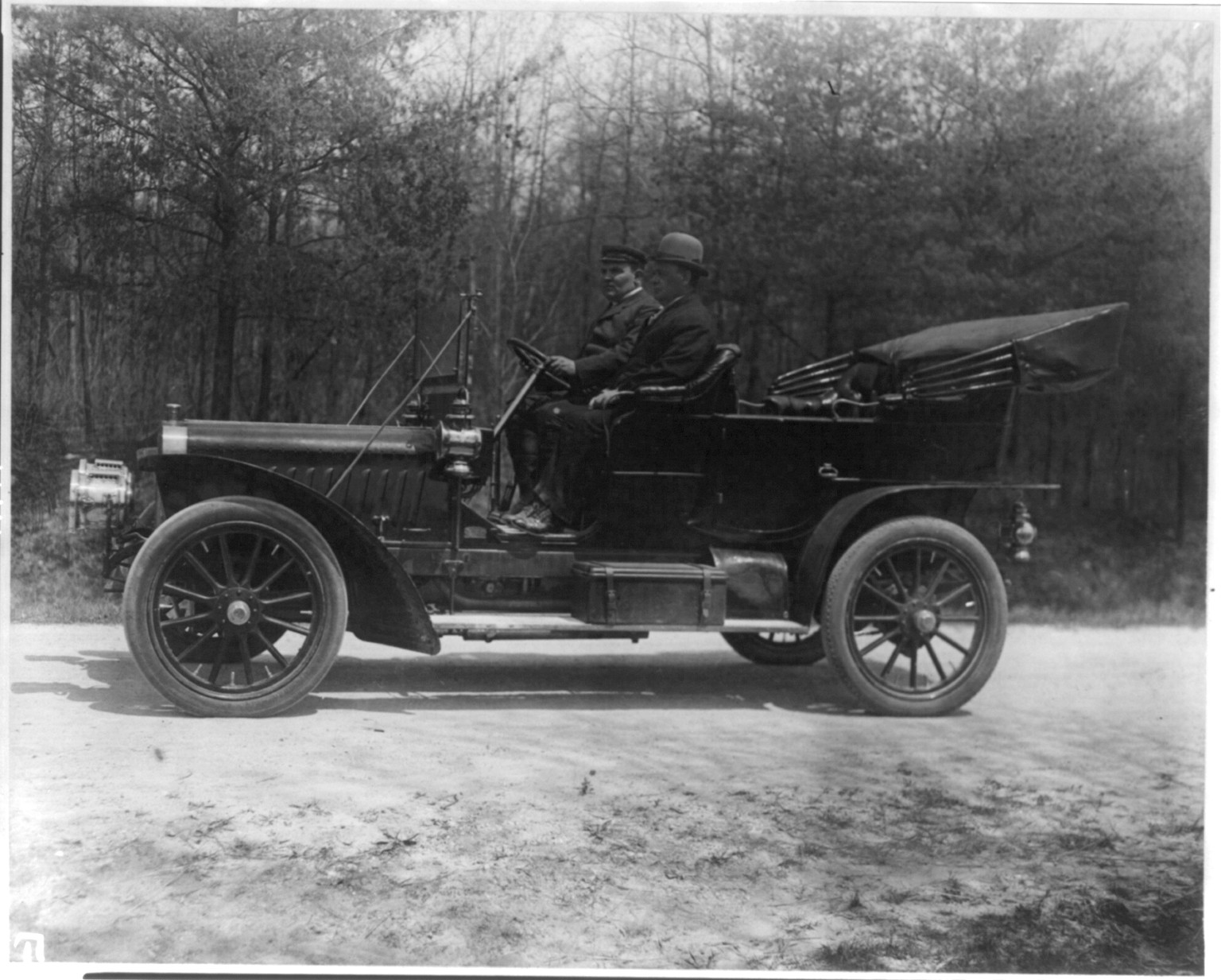 [2 men posed in automobile], [ca. 1910?] — historic photograph