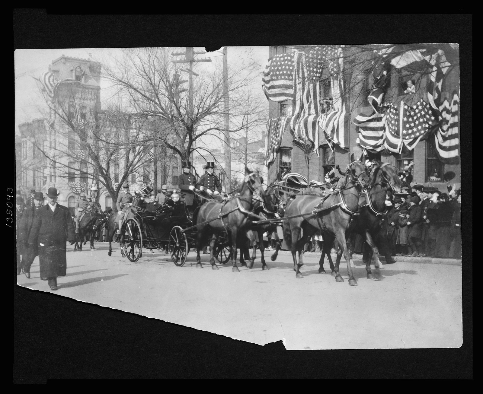 [Theodore Roosevelt sitting in an open carriage enroute to the U.S. Capitol on his inauguration day tips his hat to spectators], c1905 March 29. — historic photograph