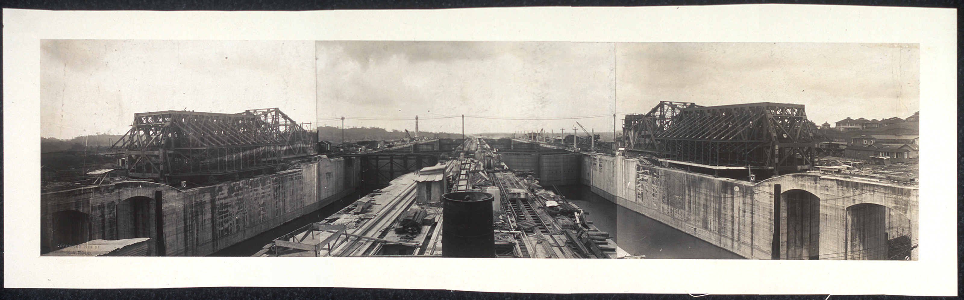 Panoramic view of canal locks with steel gate frames — historic image