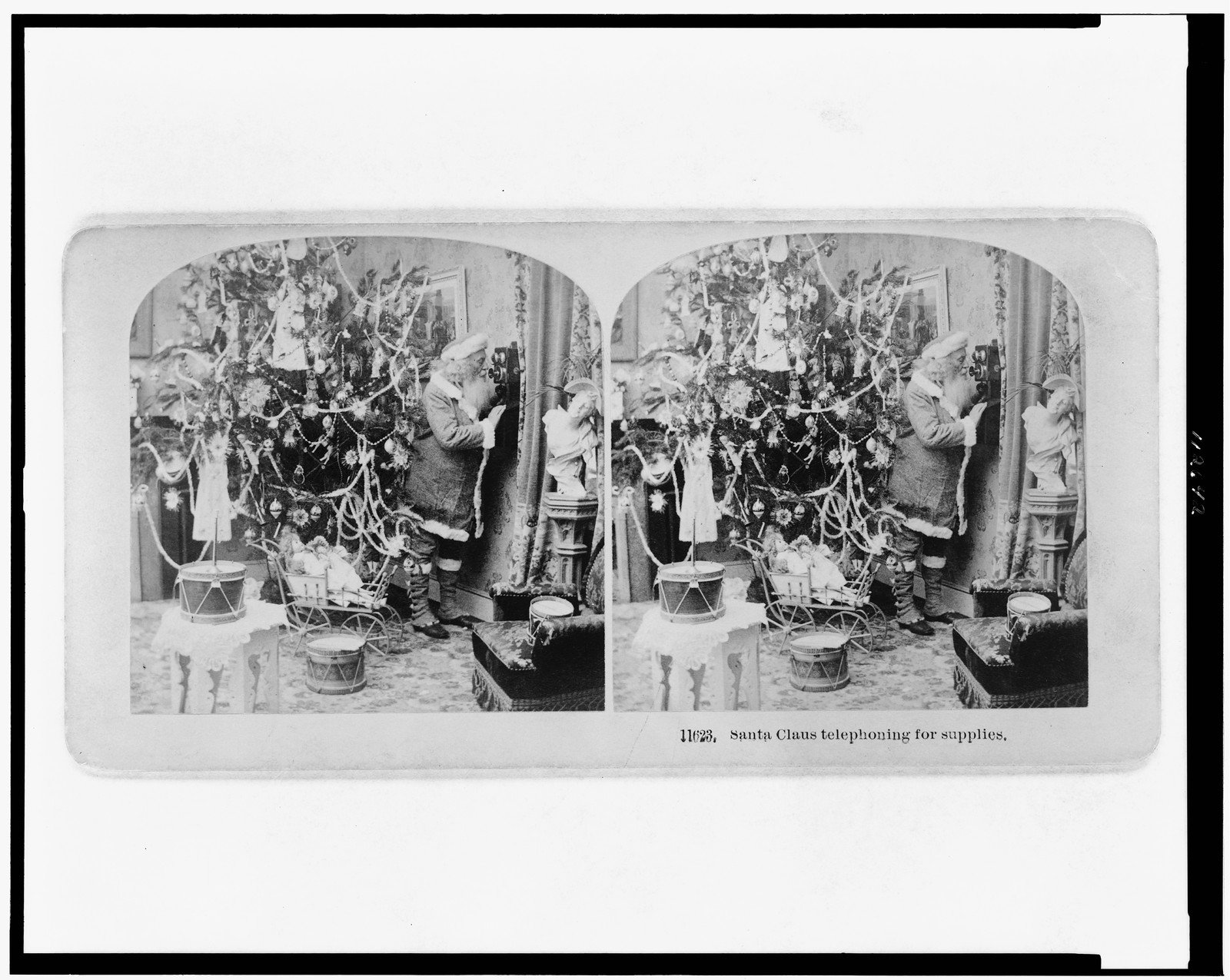 Santa Claus telephoning for supplies, Littleton, N.H. : B.W. Kilburn, c1897. — historic photograph