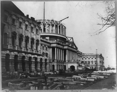 [Capitol construction, east front looking north, dome in progress]