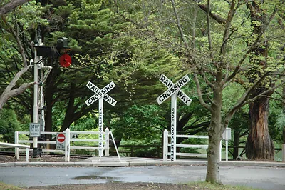 Railway level crossing with STOP. LOOK. LISTEN. signs