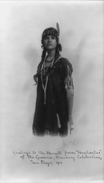 [3/4 lgth., portrait of young woman wearing Indian costume, autographed Greetings to Mr. Barrett from Pocahontas of the ground-breaking celebration 1911"]"
