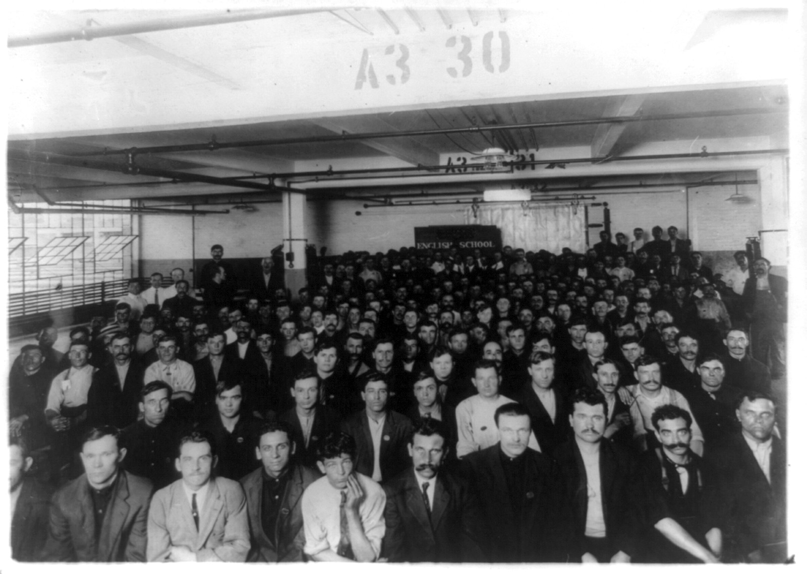 [Immigrants in English class given by Training Service of the Department of Labor in Ford Motor Co. Factory, Detroit, Michigan], [between 1909 and 1932] — historic photograph
