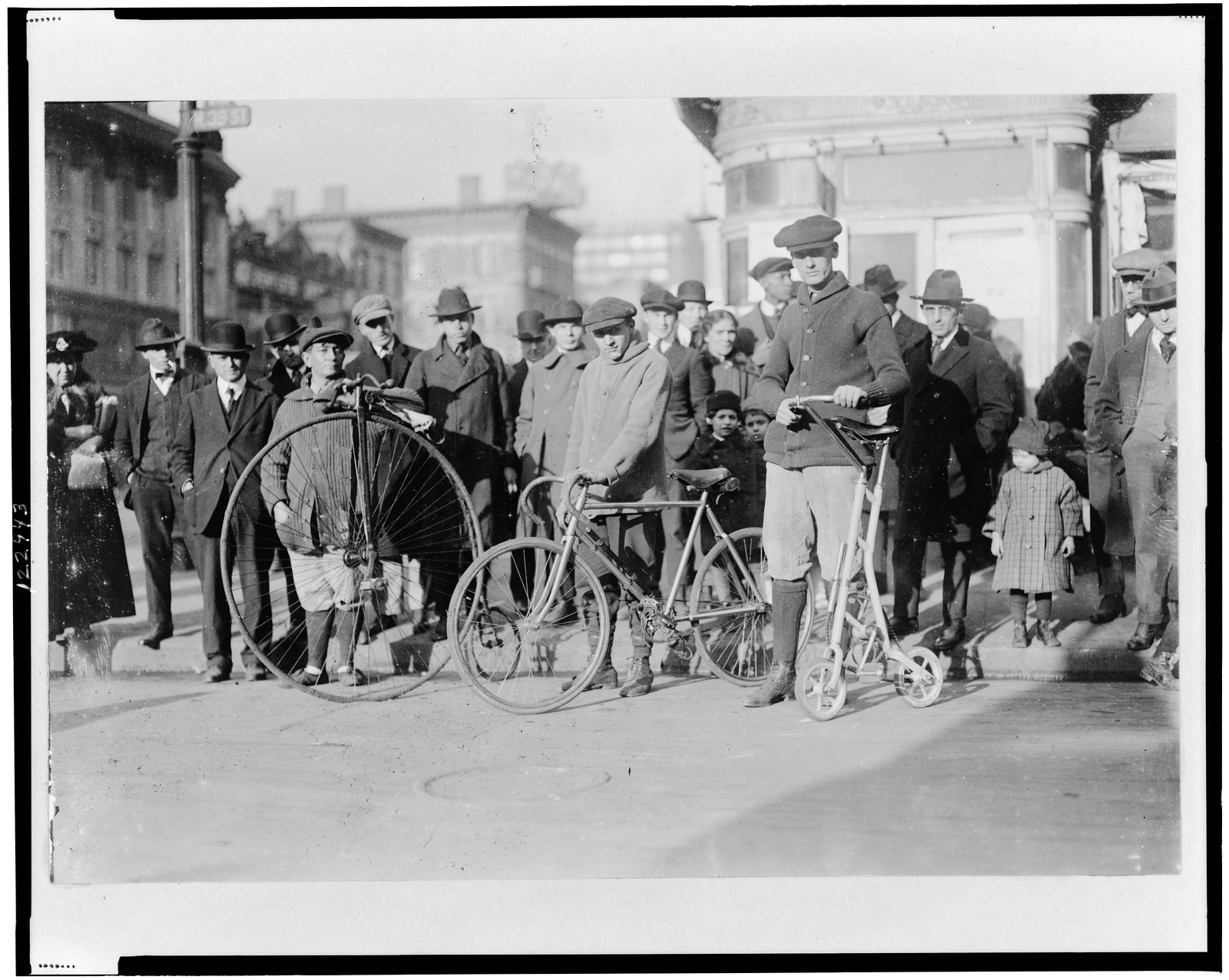 [Men with three types of bicycles], [between 1910 and 1930] — historic photograph