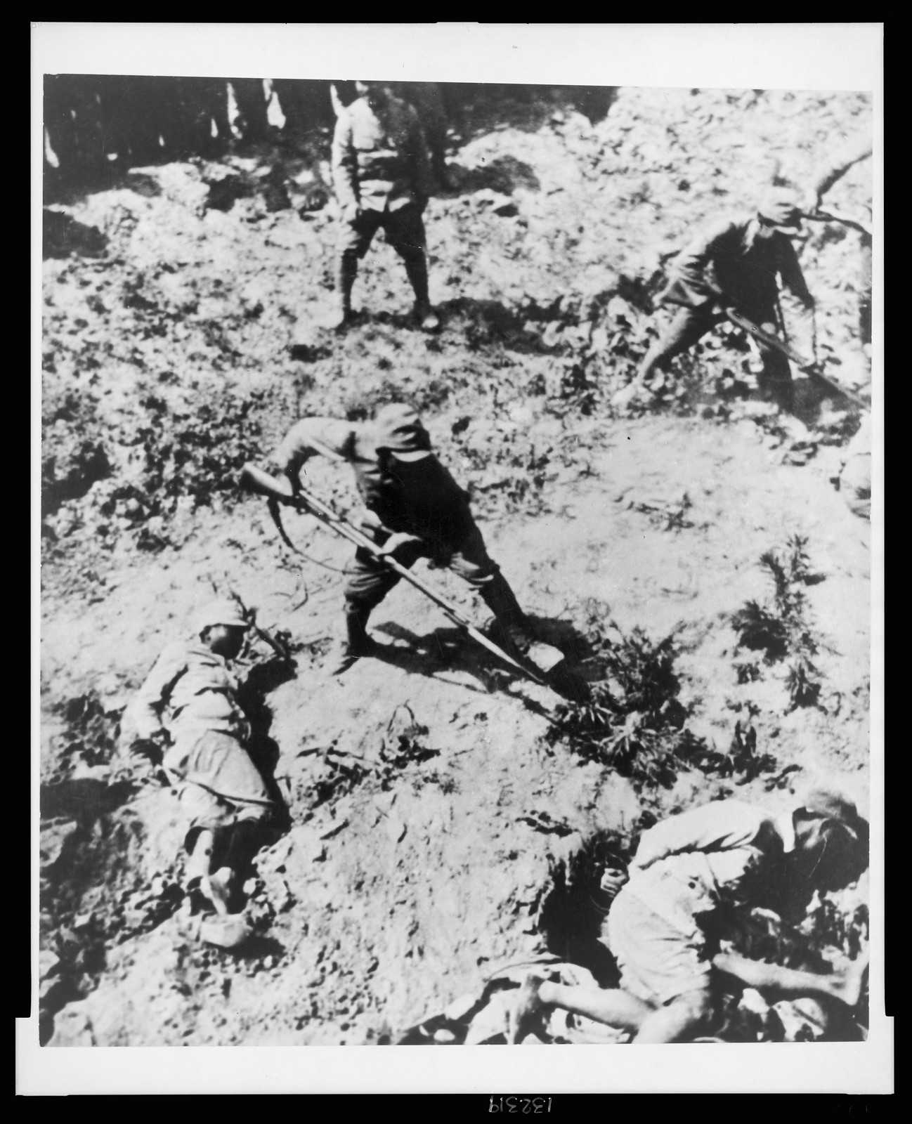 To insure perfect safety, the victims are bound by the hand, [between 1937 and 1943] — historic photograph