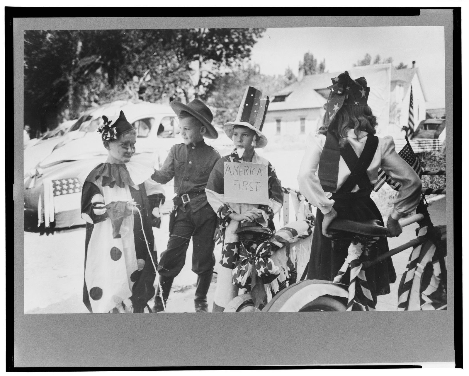 Bicycle riders in parade on the Fourth of July at Vale, Oregon, 1941 July. — historic photograph
