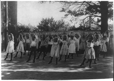 [School children learning a dance in a school yard, Washington, D.C.]