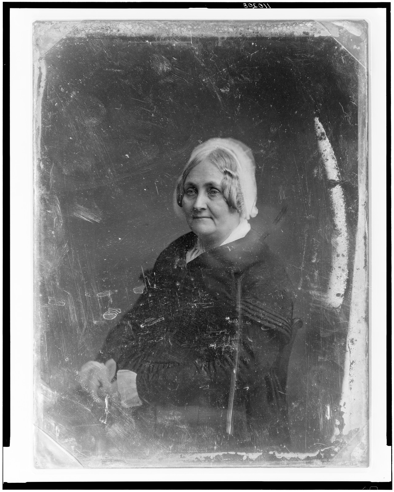 Seated portrait of an older woman in a bonnet, 1851 — historic photograph