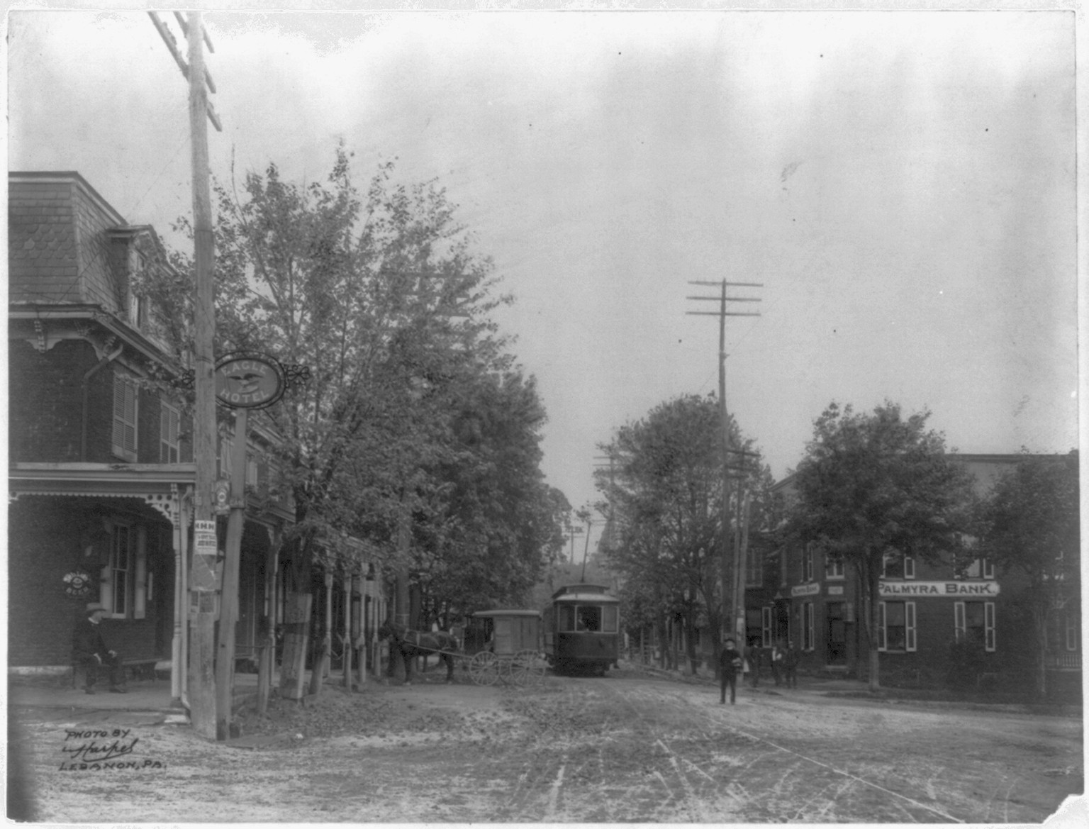 [Street railroad and horse-drawn wagon on main street of Palmyra, Pennsylvania (?)] — historic photograph
