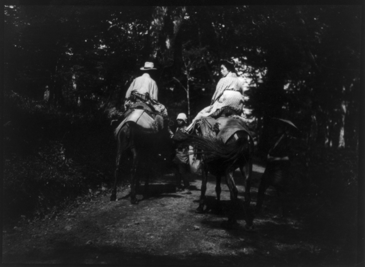 Man and woman on horseback, Japan, [no date recorded on caption card] — historic photograph