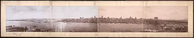 Panoramic view of New York harbor and skyline with Brooklyn Bridge