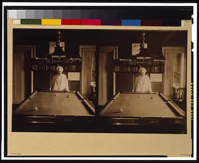 [Samuel Clemens, half-length portrait, standing at end of pool table]