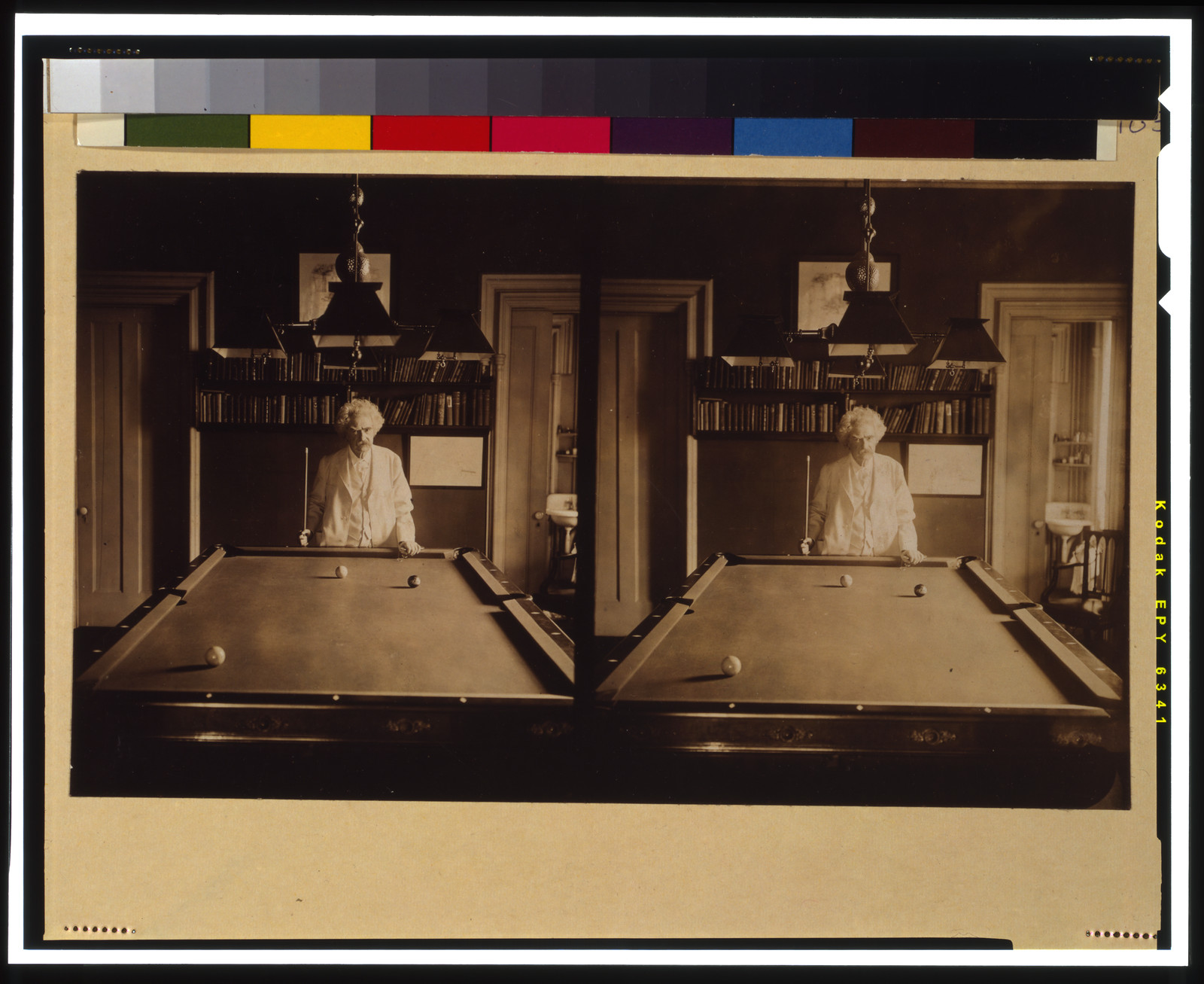 [Samuel Clemens, half-length portrait, standing at end of pool table], c1908 Jan. 11. — historic photograph