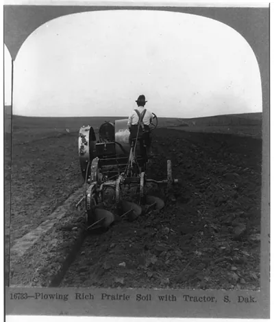 Plowing the rich prairie soil with tractor, S. Dak.