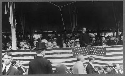 [Theodore Roosevelt, half-length, speaking at podium]