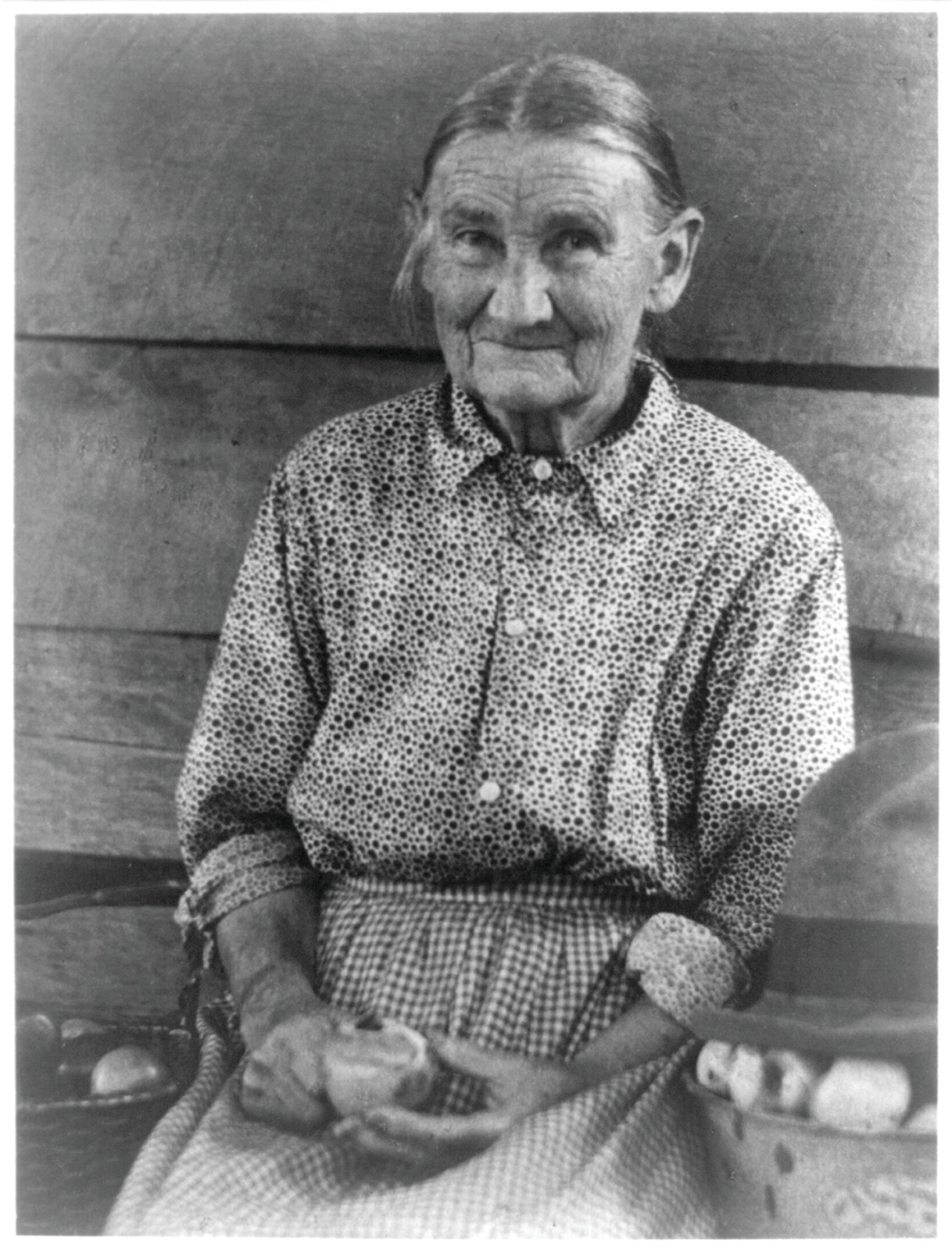 [Woman paring apple, no. 2], [ca. 1930] — historic photograph