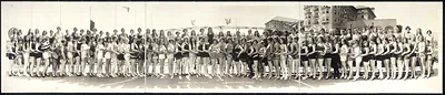 Panoramic group photograph of women in swimsuits on a beach