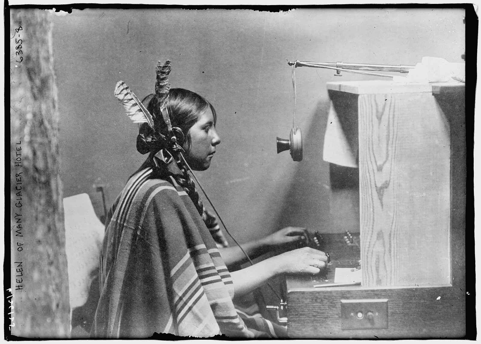 Female Indian telephone switchboard operator - "Helen of Many Glacier Hotel.", 26 June 1925, 1925 — historic photograph