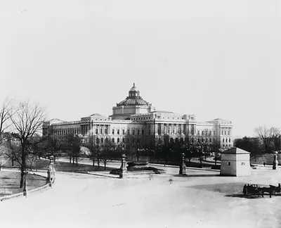 [Jefferson Building of the Library of Congress, with winter wooden housing over Horatio Greenough's sculpture of George Washington on Capitol grounds in right foreground]