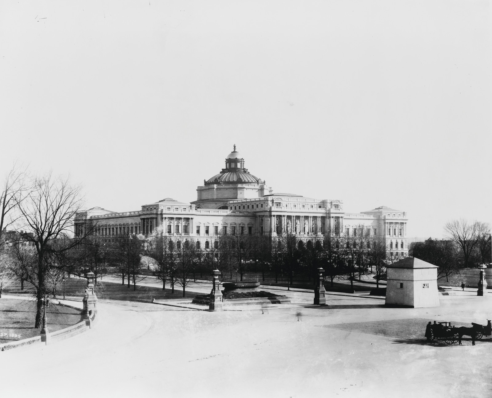 [Jefferson Building of the Library of Congress, with winter wooden housing over Horatio Greenough's sculpture of George Washington on Capitol grounds in right foreground], [1895 Nov. 27] — historic photograph