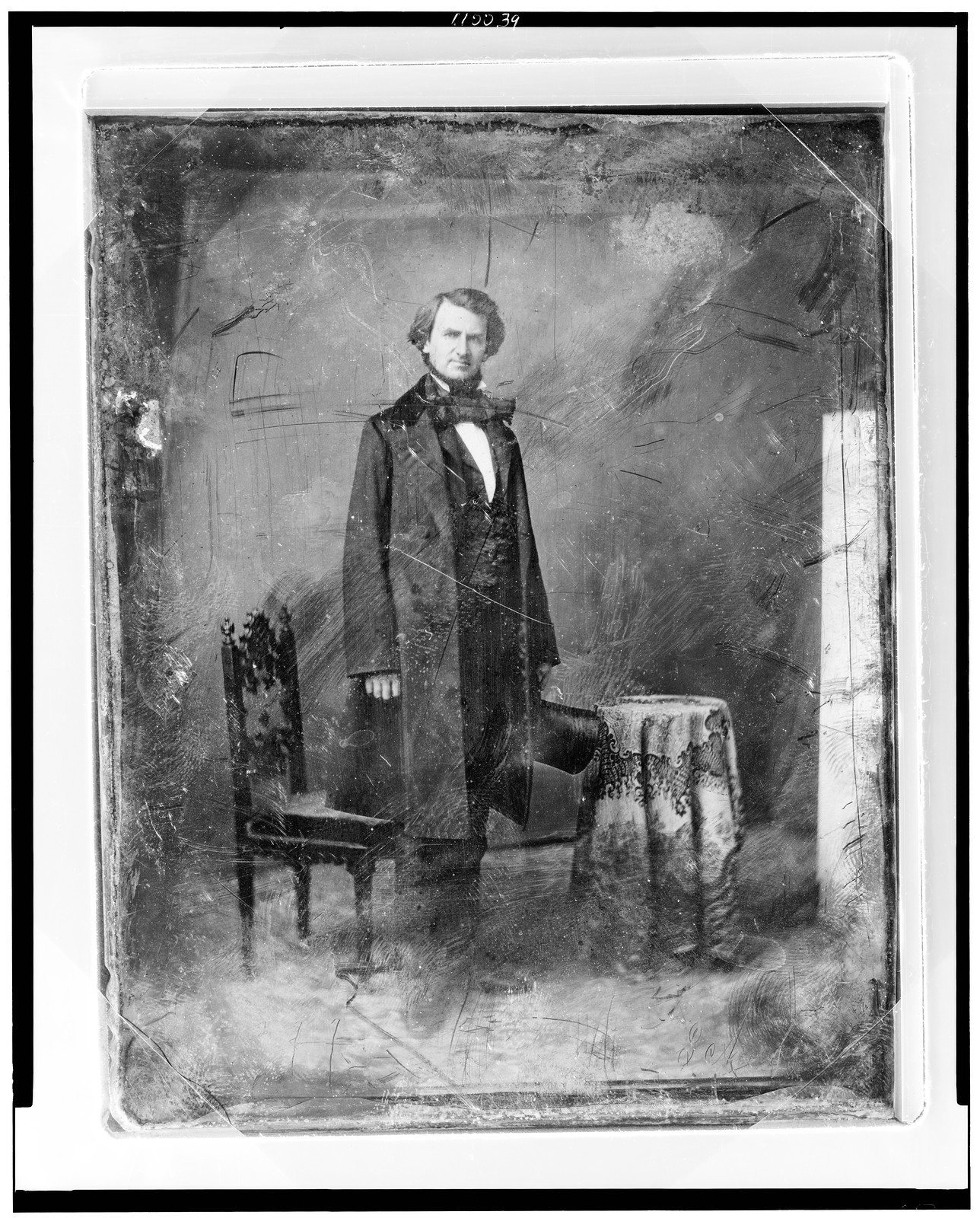 [Taliaferro Preston Shaffner, full-length portrait, three-quarters to the right, head front, standing, holding a tall hat. On the left is a chair and on the right a small table covered with tablecloth], [between 1844 and 1860] — historic photograph