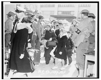 San Francisco (Calif.) evacuation - a family starts for the bus that will take them from the control station to the train depot / Signal Corps U.S. Army.