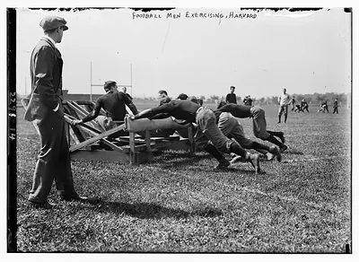 Football men exercising, Harvard.