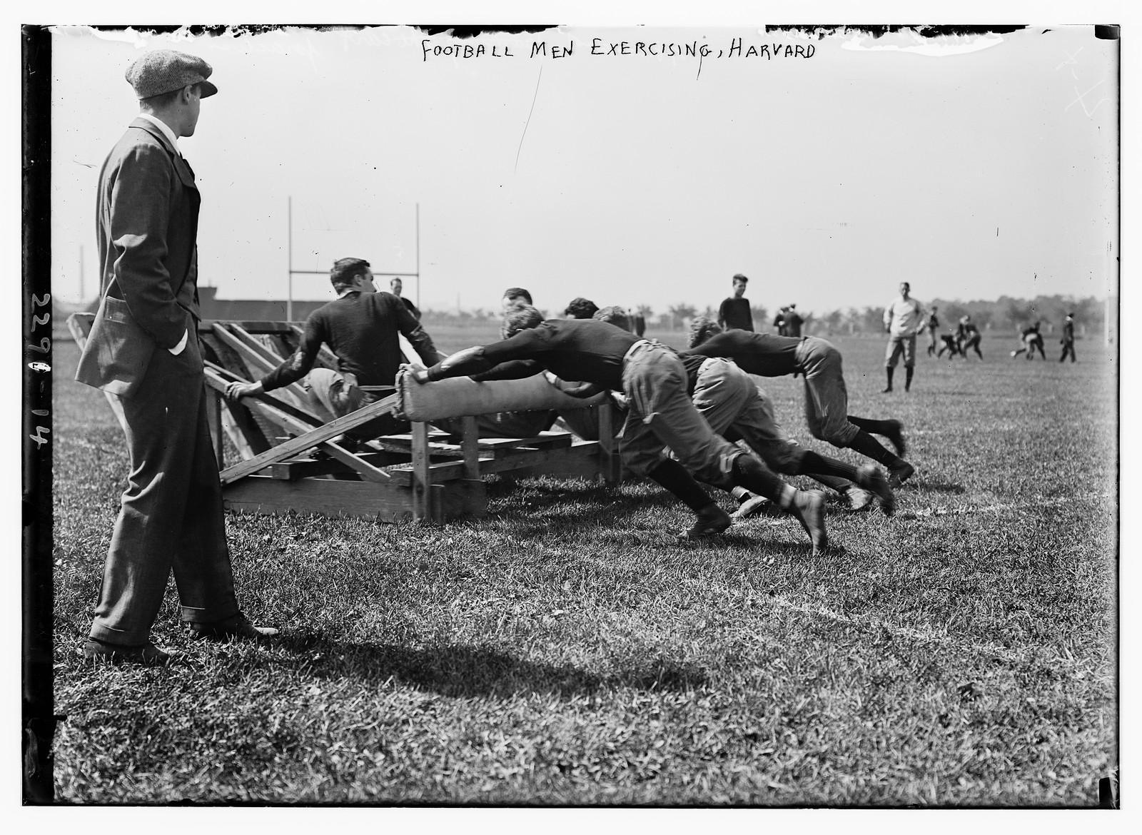 Football men exercising, Harvard., n/a — historic photograph