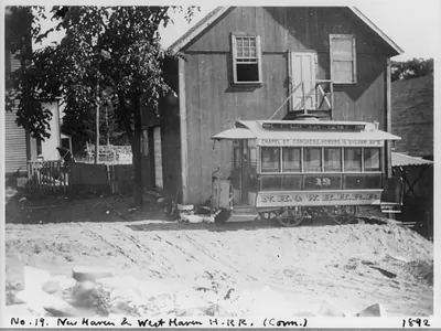 [Conn. - New Haven - horse-drawn street railways; N.H. & W.H.H.R.R. Co. cars in car barn yard: car no. 19]
