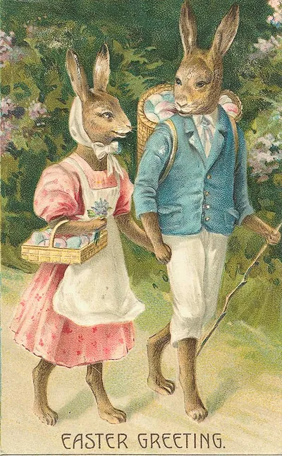 Easter Greeting card with dressed rabbits