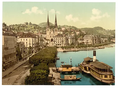 The quay Hotels Schweizerhof and National and Cathedral from the Swan Hotel Lucerne Switzerland
