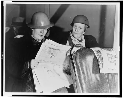 [Two American women, employed as shipyard worker on the U.S. Pacific Coast, returning to their homes in a bus, after working all night]