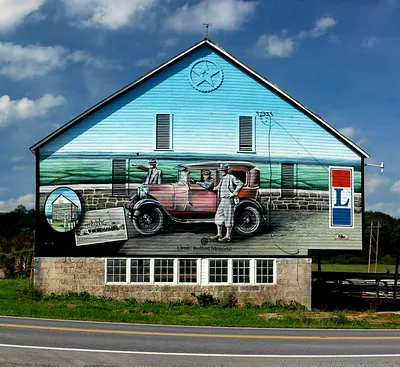 Barn mural with vintage car and two figures, UPMC Bedford Memorial