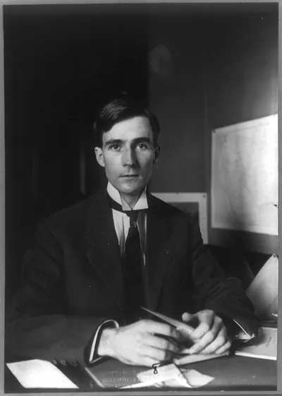 [Raymond W. Pullman, half-length portrait, seated behind desk, facing front]