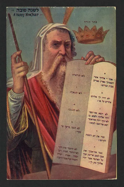 A Happy New Year postcard showing Moses holding the Ten Commandments tablets