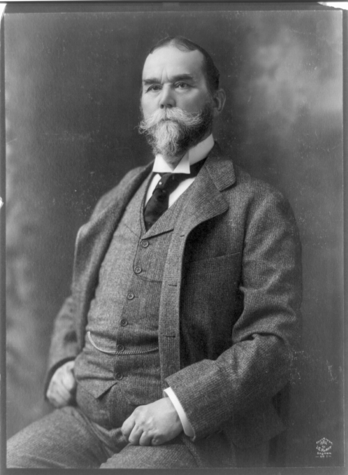 [John Hay, three-quarter length portrait, seated, facing left], c1902. — historic photograph